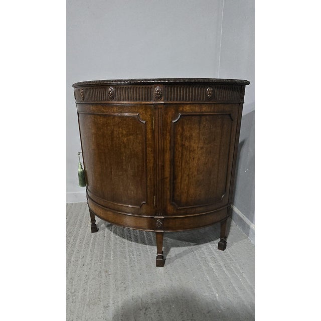 A good quality Chippendale style demi lune cabinet with single shelf, working lock. in overall very good condition. 36"...