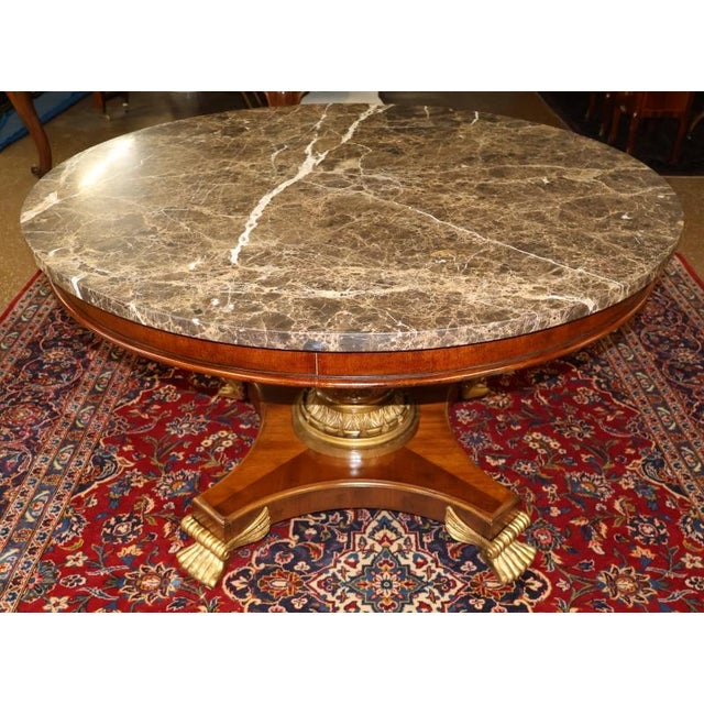 Mahogany Neo Classical Regency Style Marble Top Dining Center Table Dimensions : 50" Round X 30" Tall This center table is...