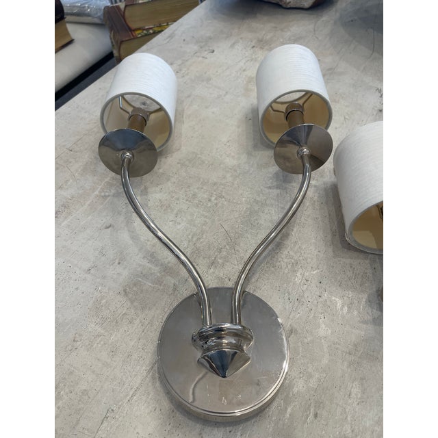 Enhance your space with timeless charm using this pair of vintage silver sconces, each featuring two elegantly curved...