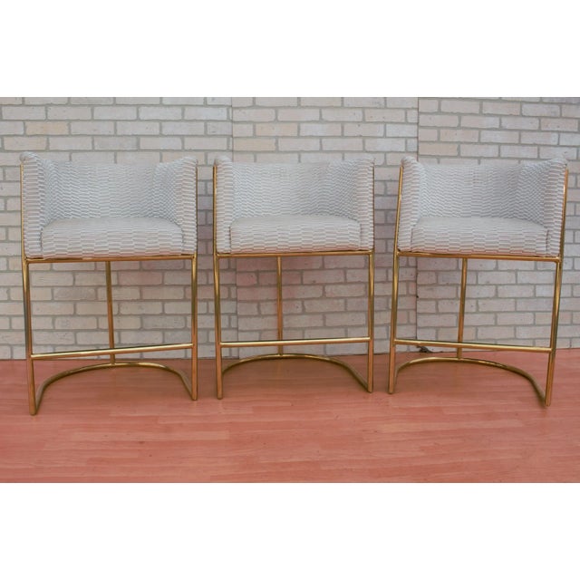 Mid Century Modern Barrel Back Bar Stools on Brass Bases Newly Reupholstered in High End Italian Patterned Cream and Gold...