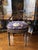 Vintage English Regency Caneback Chair painted in black and gold motiffs. Excellent structural condition, lightweight.....