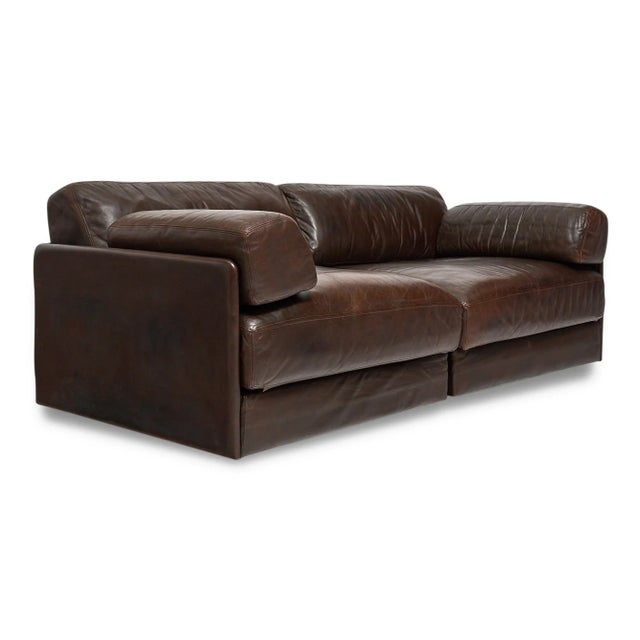 Sofa, from Switzerland, DeSede exclusive, Model DS 76, upholstered in thick brown leather hide. The sofa consists of two...