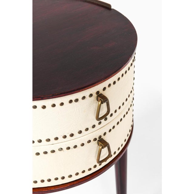 This rare pair of bedside or side tables was designed by Swedish designer Halvdan Pettersson and produced by Tibro...