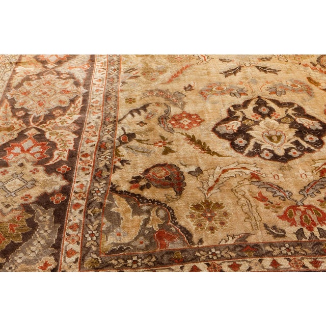 Made around 1910 in the city of Sultanabad in Iran, this stunning antique area rugs is everything a stylish home could ask...