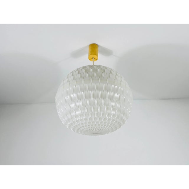 Peill & Putzler pendant lamp, designed by Aloys Gangkofner in 1970. This elegant white lamp features a minimalist design...
