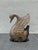 A richly carved folk art swan sculpture featuring hand-worked feather detailing and inset jewel-tone accents throughout....