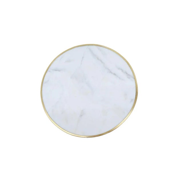 This is a French Gueridon Table Blanco Ibiza Marble top, surrounded by a bronze trim, this beautiful table looks in...