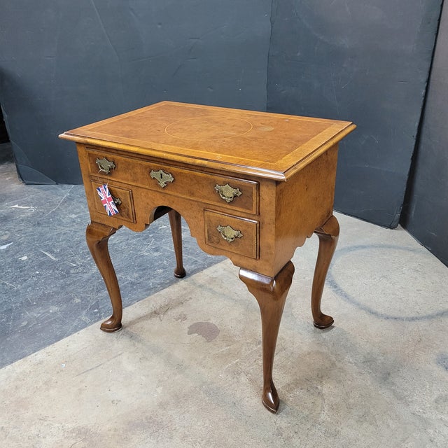 This is a nice example of an English Burl Walnut Inlaid Cabriolet Leg 3 Drawer Lowboy. It works great as a side table or...