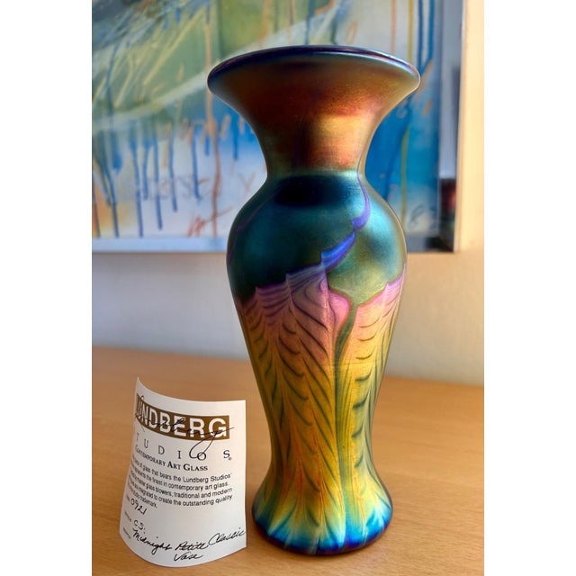 This is a "Midnight Petite" Classic Vase by Lundberg Studios measuring 7.75" high and 3.5" wide. Stunning iridescent gold,...