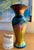 This is a "Midnight Petite" Classic Vase by Lundberg Studios measuring 7.75" high and 3.5" wide. Stunning iridescent gold,...