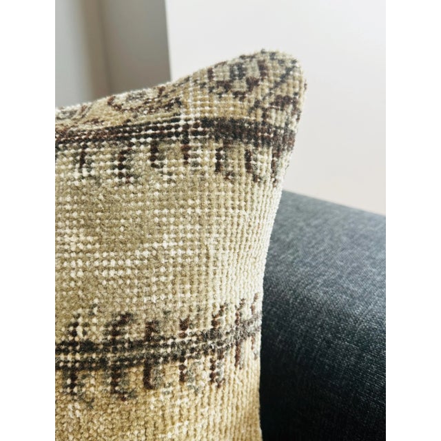 Tam Description: Add a touch of timeless elegance to your home with this one-of-a-kind vintage Turkish Isparta rug pillow...