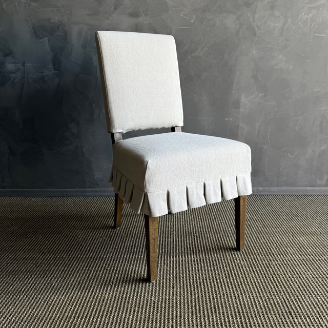 Introducing the elegant Reese white oak dining chairs in Montana Brown Oak, featuring custom slipcovers crafted from...