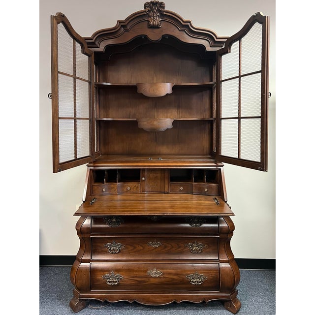 Exquisite Vintage Henredon "Four Centuries" French Country / Baroque style secretary desk and bookcase. This commanding...