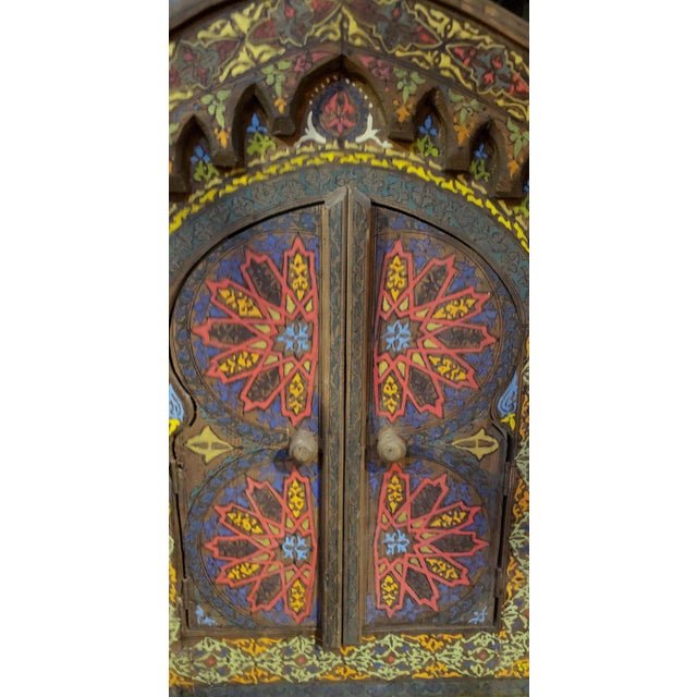 Multicolor Zouak patterns on this beautiful Moroccan cedar wood frame measuring approximately 22.5” in height, 17.5” in...