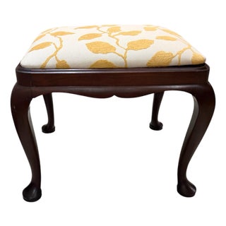 Vintage Queen Anne Style Footstool Features Dark Wood Cabriole Legs With Pad Feet and an Off-White Cushion Upholstered in a Yellow Leaf Pattern For Sale