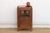 This 38-inch tall cabinet is a prime example of "small-space" colonial utility. Crafted from solid teak with a rich,...