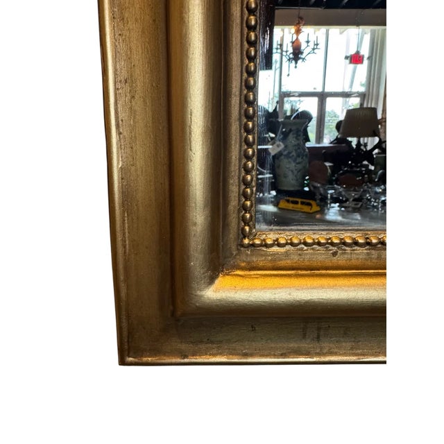 32 1/2”W x 58 1/2”H x 1 3/4”D Crest Depth: 5 3/4”D Evoking the elegance of the Louis Philippe era, the French mirror...