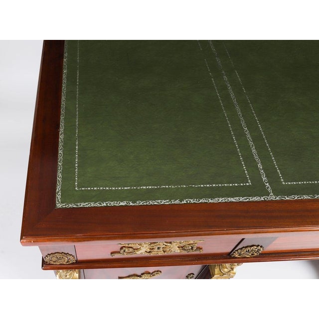 A superb napoleon iii revival ormolu mounted empire mahogany pedestal desk circa 1930 in date. This imposing empire...