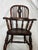 An English Elm and Yew wood Child's Windsor Chair, circa 1840-60, standing only 33" tall and retaining its original crusty...