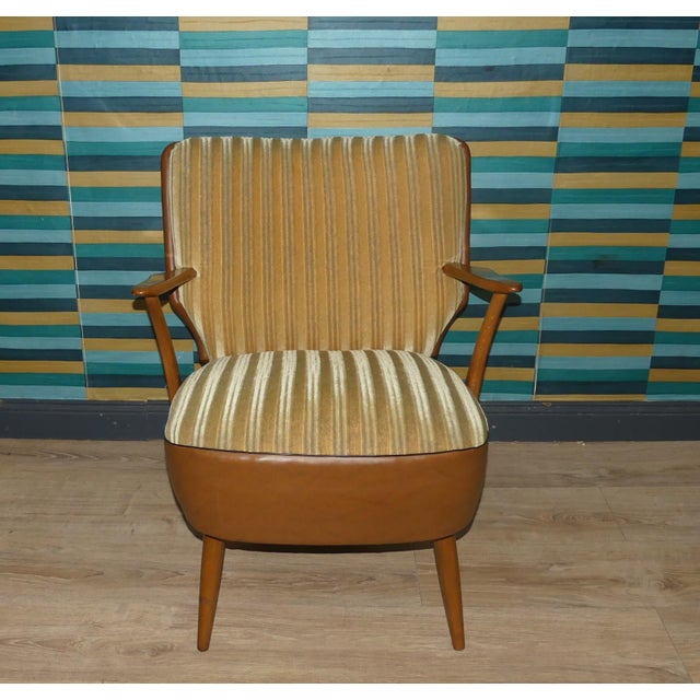 Elegant armchair Original 1950s cocktail chair with armrests High-quality construction with faux leather Beautifully...