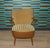 Elegant armchair Original 1950s cocktail chair with armrests High-quality construction with faux leather Beautifully...