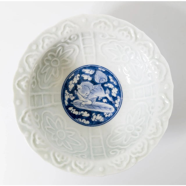 We are selling this interesting Chinese or Japanese 20th century bowl. This celadon bowl has pale green celadon glaze with...