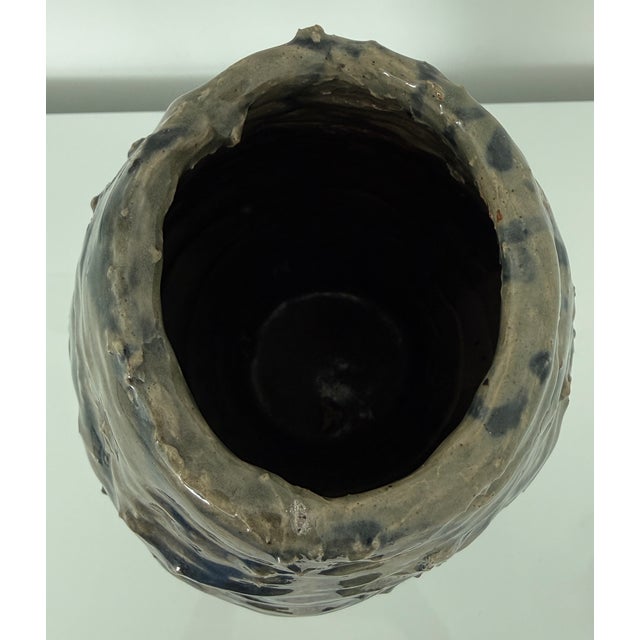 1970's Studio art pottery vase Brutalist style. The vase features a heavily textured, rustic surface with irregular,...