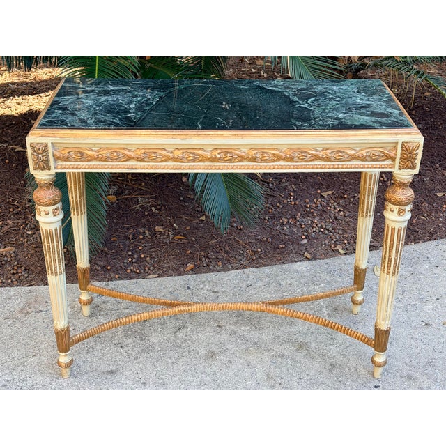 Handsome marble top parcel gilt and paint console table. Wonderful dark green marble and light green paint. Great size...