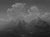 The artwork depicts a dramatic mountainous landscape rendered in a monochromatic palette, emphasizing the interplay of...