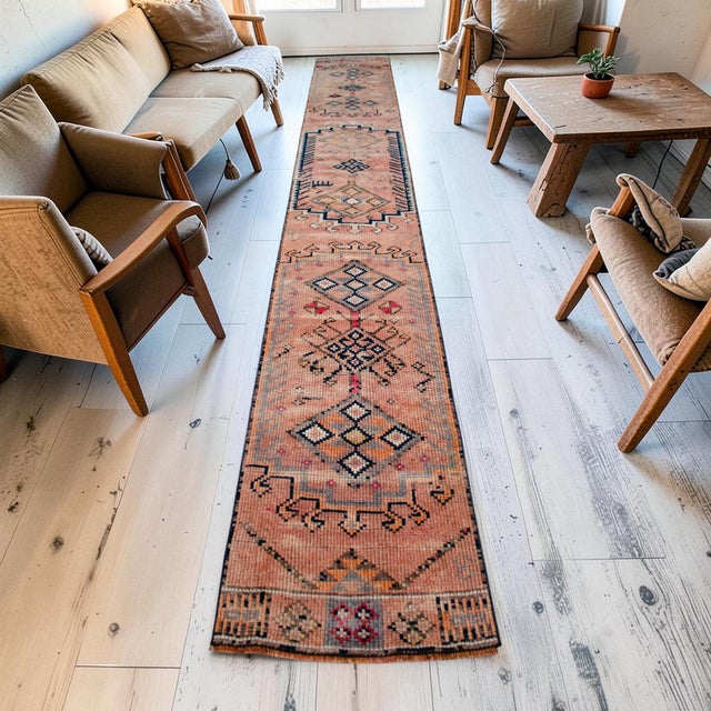Hand-knotted in Southeastern Anatolia during the 1960s, this extra-long vintage runner was originally woven by villagers...