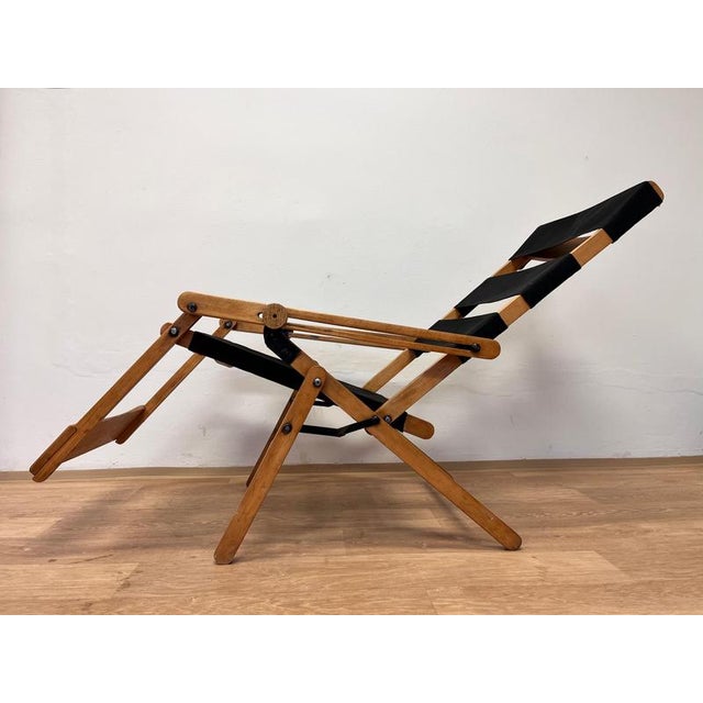 - Good condition. - wooden parts refreshed - new textile - marked by manufacturer This piece is attributed to the...