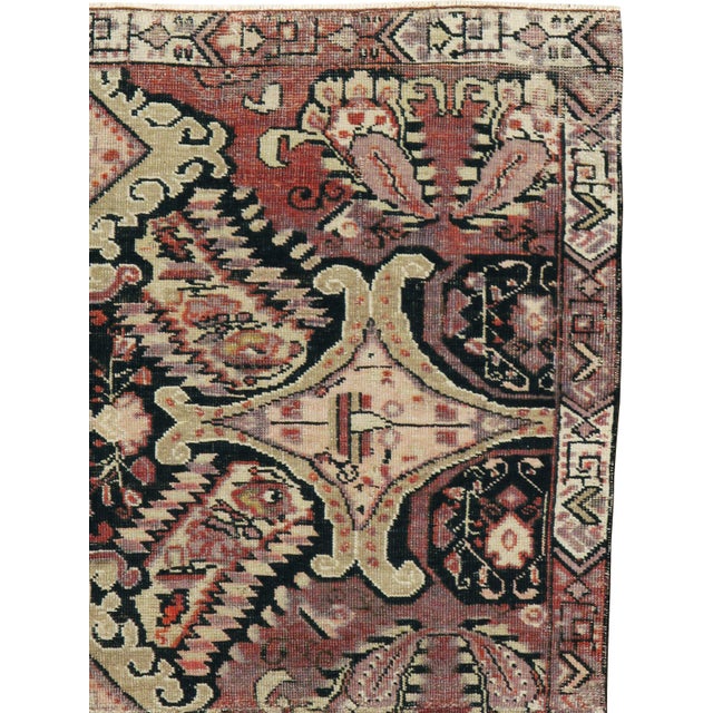 An antique Caucasian Karabagh rug from the early 20th century. Measures: 3' 11" x 7' 7"