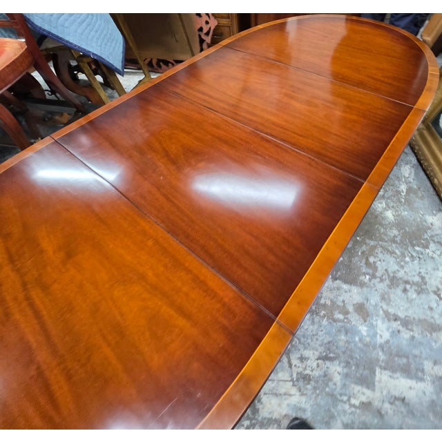 English Regency Revival Flame Mahogany Oval Extension Dining Table With Satinwood Crossbanding and Brass Paw Feet, Circa 1935 For Sale - Image 9 of 9