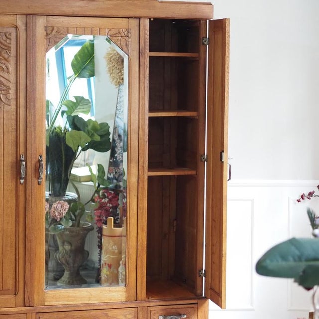 Three-door oak wardrobe, crafted around 1930 in the Art Deco style. The design follows a clear vertical rhythm, with...