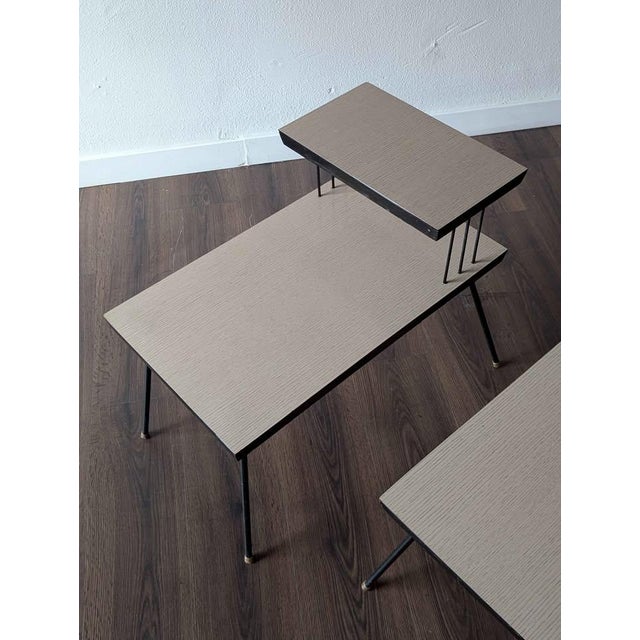 Cool little set of mid century modern laminate top tables. Vintage original. Circa 1950's. Top Height 21.75" Top Depth 9"...