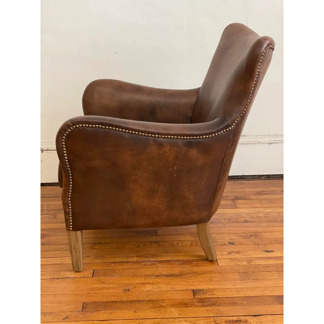 Great Mid Size chair with awesome curves from Timothy Oulton upholstered in limited edition hand finished coffee leather....