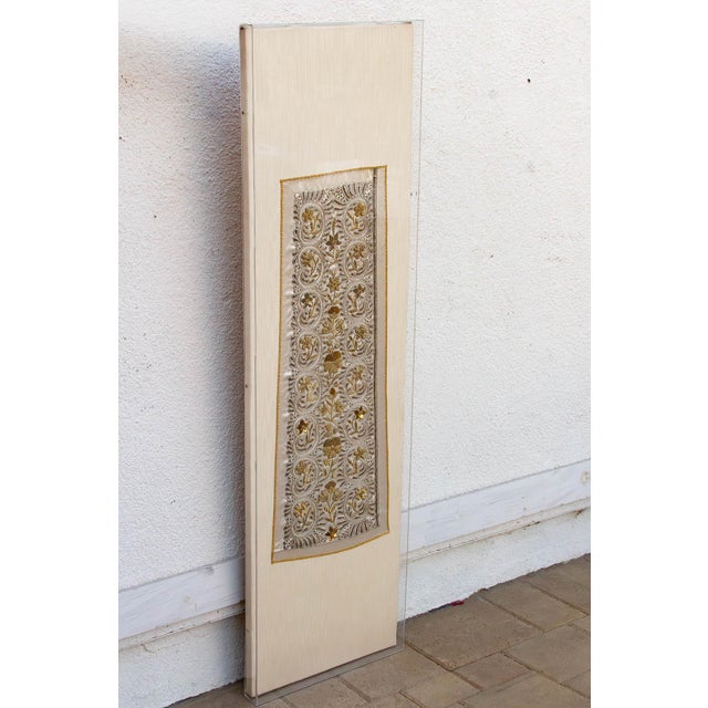 The Gilded Stole is a profound study in vertical symmetry and global artisanal collaboration. This antique textile...