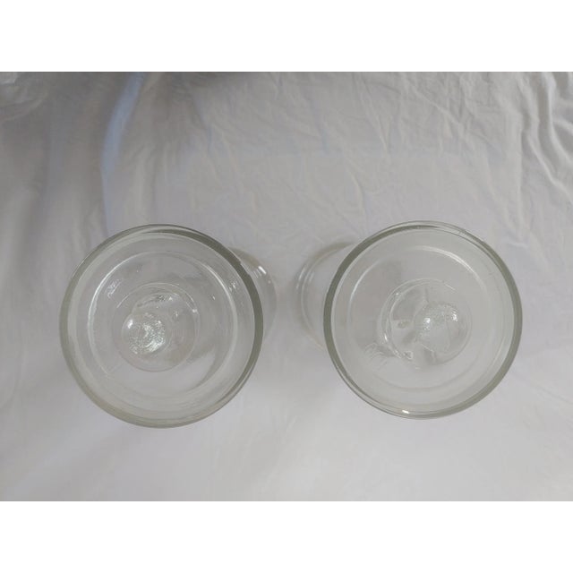 Offering a set of vintage apothecary jars. These have bubbles in the glass from being blown into molds. The covers have...