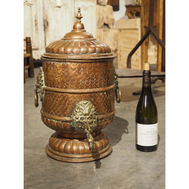 Based on the exquisite detailing and brass embellishments, this rare copper water fountain would have most likely belonged...