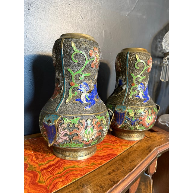 Beautiful detailed pair of Chinese champleve spill vases. Gorgeous etching and enamel detail.