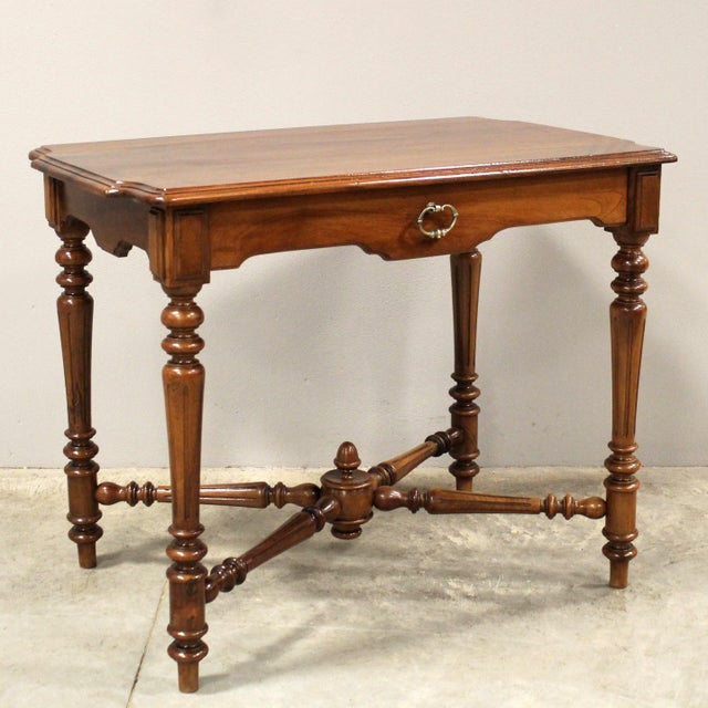 Coffee table - writing desk Solid walnut, with drawer Late 19th century Dimensions: 90 cm x 59 cm, height 72 cm Restored...
