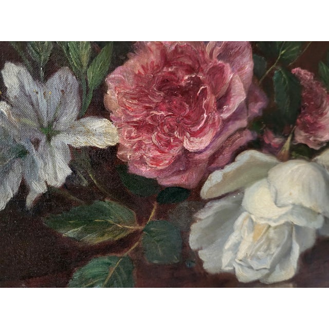 This exquisite late 19th-century French oil on canvas still life painting features an arrangement of pink and white roses...
