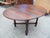 Presenting a timeless and versatile vintage/antique drop-leaf dining table, an exquisite piece that blends classic design...