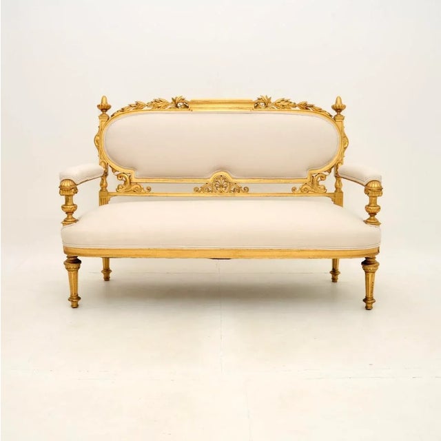 An incredibly beautiful antique Swedish Empire gilt wood settee. This was recently imported from Sweden, we would date it...