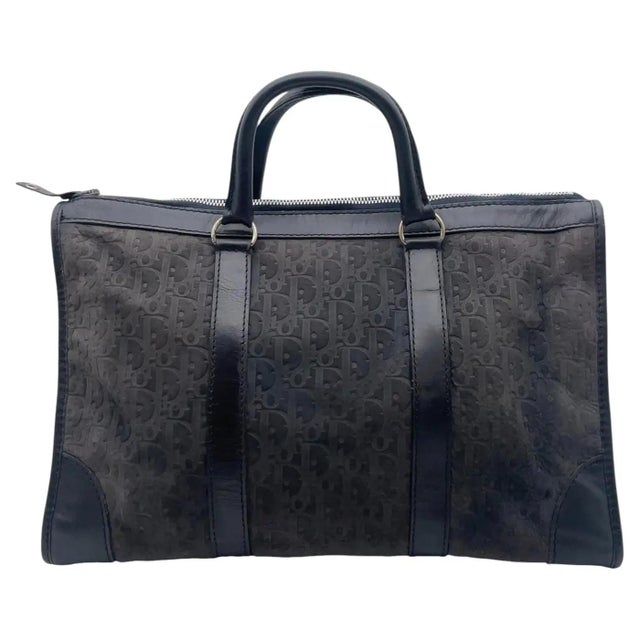 This sophisticated vintage Christian Dior Boston bag is a rare and striking find, beautifully pairing the iconic Trotter...