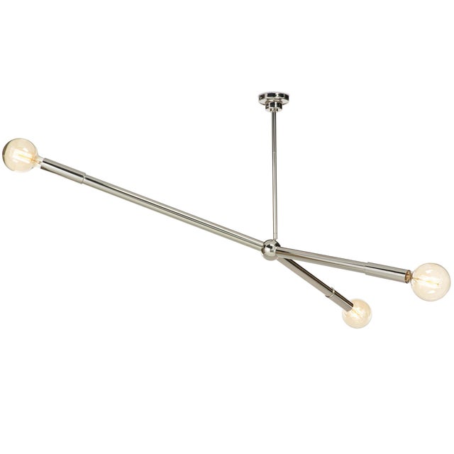 The Talon Chandelier exudes modern form and function. Its artfully suspended arms can be angled up or down from its...