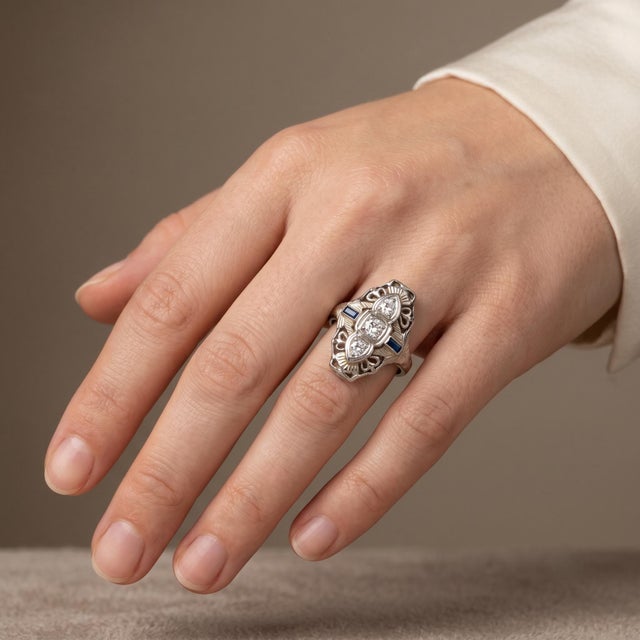 Discover the elegance of our Vintage Filigree Ring, crafted from luxurious 18k white gold and featuring intricate...