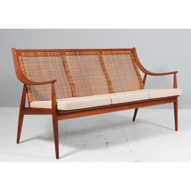 Peter Hvidt & Orla Mølgaard Nielsen three seat sofa with back of cane. New upholstered with Coda fabric from Kvadrat....