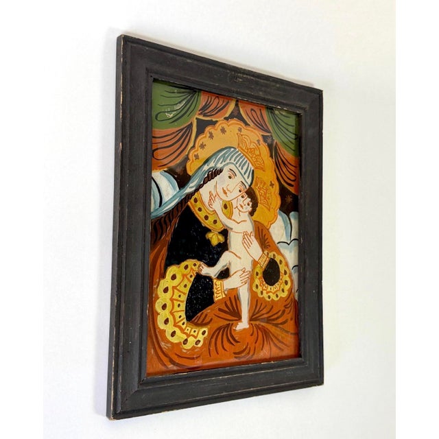 Vintage German reverse painting on glass of Madonna and Child. Beautiful folk art painting in vibrant colors with gilt...