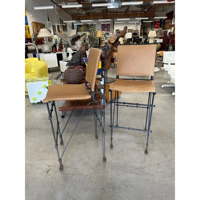 A nice pair iron and leather stools likely designed by Ilana Goor the noted Israeli designer. We’ve had the leather redone...
